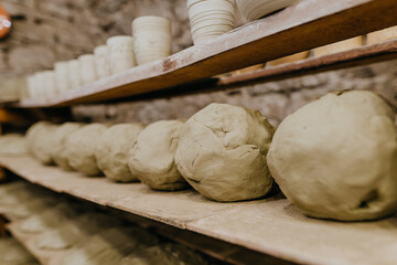 Wet clay prepairing for the work on the shelf