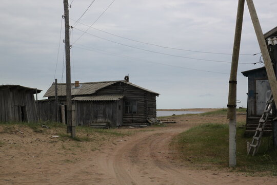 Very old buildings on the coast of the Varzuga river. Kuzomen, Russia
