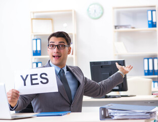 Naklejka premium Businessman in positive yes answer in the office