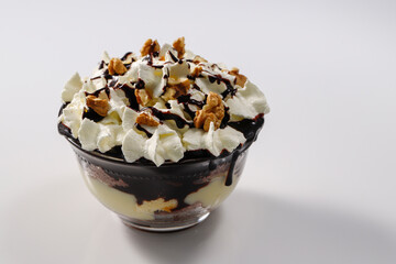 Creamy dessert with chocolate, vanella, whipped cream and walnut, called Somloi Galuska