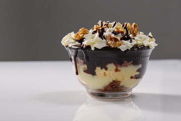 Creamy dessert with chocolate, vanella, whipped cream and walnut, called Somloi Galuska