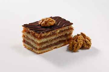 Layered cake with chocolate, walnut and apricot jam, called Zserbo