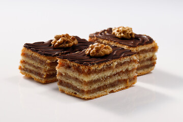 Layered cake with chocolate, walnut and apricot jam, called Zserbo
