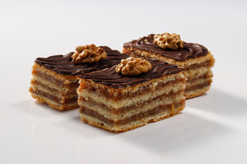 Layered cake with chocolate, walnut and apricot jam, called Zserbo