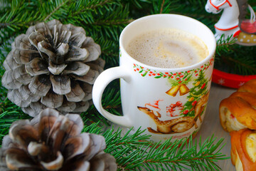 Obraz na płótnie Canvas Hot winter drink chocolate with whipped cream, Christmas time. Cozy home atmosphere, cones, christmas decoration