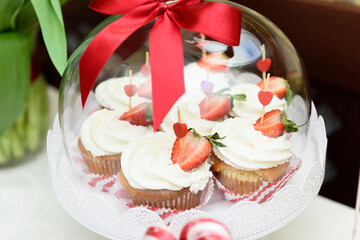 Delicious cupcakes on a sweet table at the wedding party
