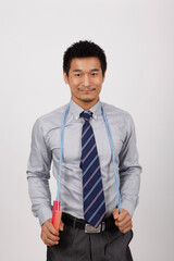 A young business man exercising with rope skipping 