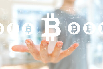 Bitcoin theme with young man holding his hand