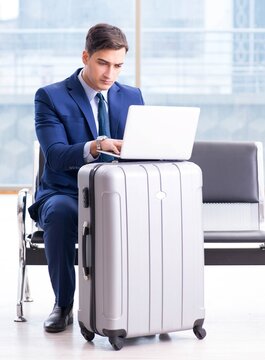 Businessman waiting at the airport for his plane in business cla