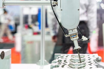 high technology accuracy and modern automatic picking by vacuum or suction during assembly intake & exhaust valve with cylinder head engine or parts product of manufacturing process in industrial