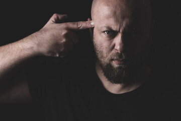 portrait of a man thinking of committing suicide