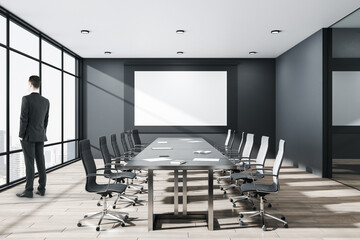 Businessman standing in conference room