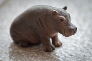 Sitting baby hippopotamus rubber toy