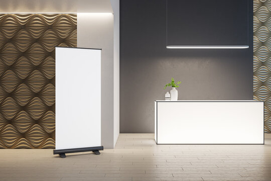 Luxury office loby with glowing reception table and blank vertical banner.