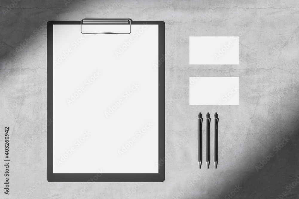 Poster top view of concrete desktop with blank clipboard
