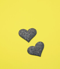 Gray silver heart for valentine's day isolated on yellow background. Panton 2021. Glitter and sparkle hearts. Expensive ornate banner. Valentine's day background