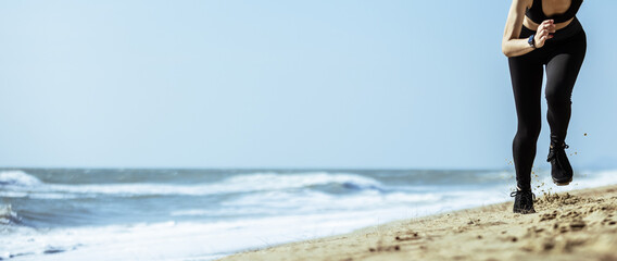 Banner of athlete muscle woman sprint running on beach with copy space