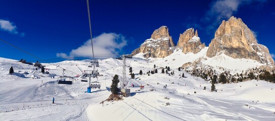 Winter Panorama of Ski Slope and Snowy Rock in Selva Di Val Gardena in Italian Dolomites. Beautiful Winter Scenery in Italy.