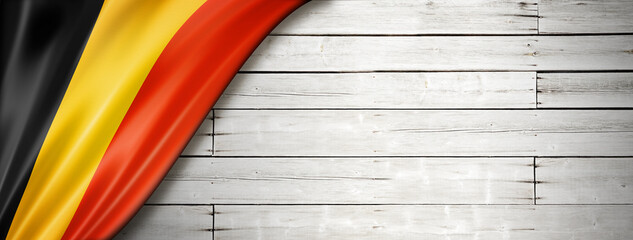 Belgian flag on old white wall banner