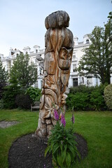 Wood sculpture of different animals and flowers