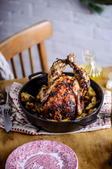 ROAST CHICKEN WITH potatoes.