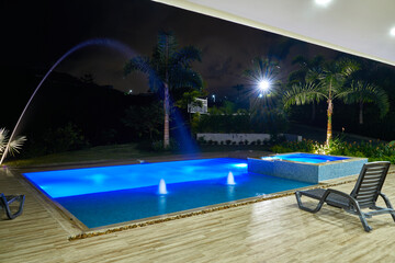 Night swimming pool area in the country hotel of the coffee region of Colombia. Colombian coffee axis. Coffee cultural heritage.