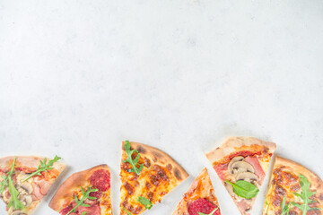 Pizza party concept.  Set of pizzas with various fillings, Pieces of different pizza, glass and bottle with wine. Flatlay top view copy space on white background