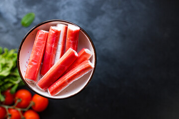 crab sticks seafood semi-finished fish mince ready to cook and eat on the table for healthy meal snack outdoor top view copy space for text food background rustic image diet pescetarian