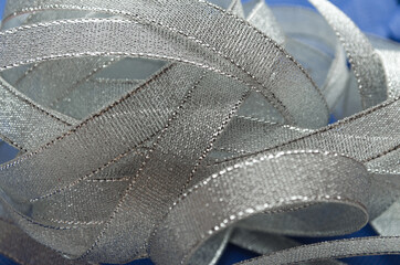 Silver color ribbon.  A bunch of transparent cotton ribbons with gold trim