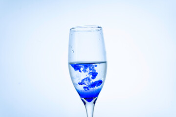Blue ink in a glass of water