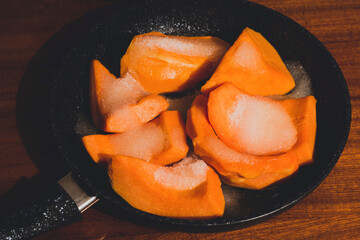 Pumpkin with sugar poured on it to make dessert