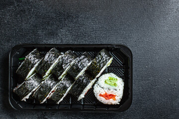 sushi rolls set salmon, rice, nori wakame tobiko caviar fresh snack on the table meal snack ingredient top view copy space for text food background rustic image