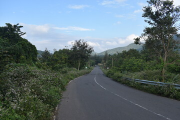 beautiful landscape view of hill mountain road green forest