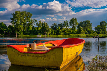 Small boat on the calm lake
