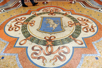 Mosaic pavement with shields in the Galleria Vittorio Emanuele II in Milan, Italy