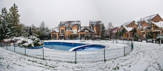 Snow covered yard in a beautiful neigborhood in Bucharest.Christmas landscape