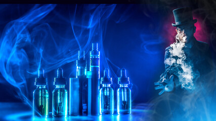 The concept of hovering on a dark background. Electronic cigarettes and liquids. A man smokes an electronic cigarette against the background of vaping accessories. VAPE shop.