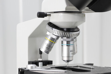 revolver system of biological microscope lenses in the laboratory