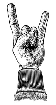 A hand doing a heavy metal rock music sign gesture in a vintage woodcut retro style