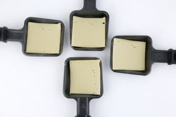raclette tools to heat swiss alps cheese