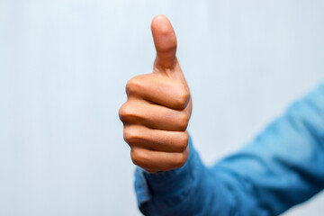 a gentleman showing his thumb.thumps up showing.like symbol.