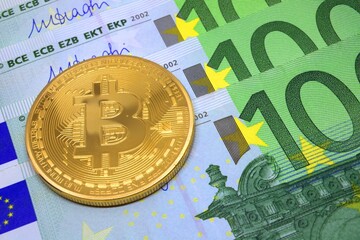 Bitcoin coin on the background of the euro. Virtual cryptocurrency concept. BTC vs EUR.