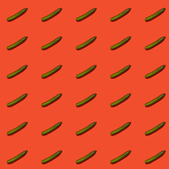 Colorful pattern of green cucumbers on a red background. Pattern.
