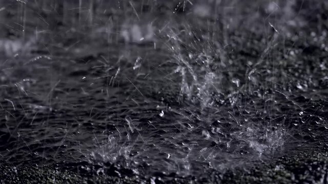 Heavy rain on a road. Closeup. 