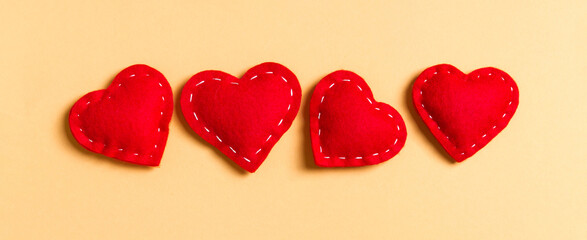 Top view of textile hearts on colorful background. Valentine's day concept with copy space