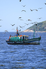 Fototapeta premium Fishing Boat at Itacoatiara Beach, Rio de Janeiro, Brazil