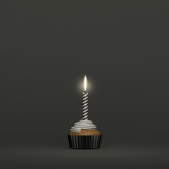 A birthday candle lighting on a creamy muffin cupcake on dark background and dark colors and space...