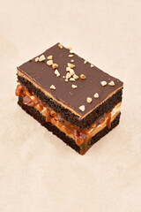 Dark biscuit cake with cream interlayer and chocolate fondant