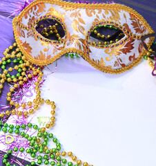 Mardi gras mask and beads frame for text on white space background. Madi gras celebration fat tuesday carnival © Lucia Fox
