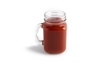 Tomato juice in glass on a white background. View from the top.